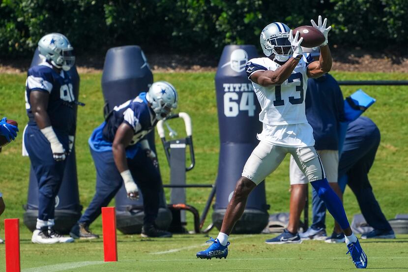 Dallas Cowboys wide receiver Michael Gallup (13) catches a pass during the team's practice...