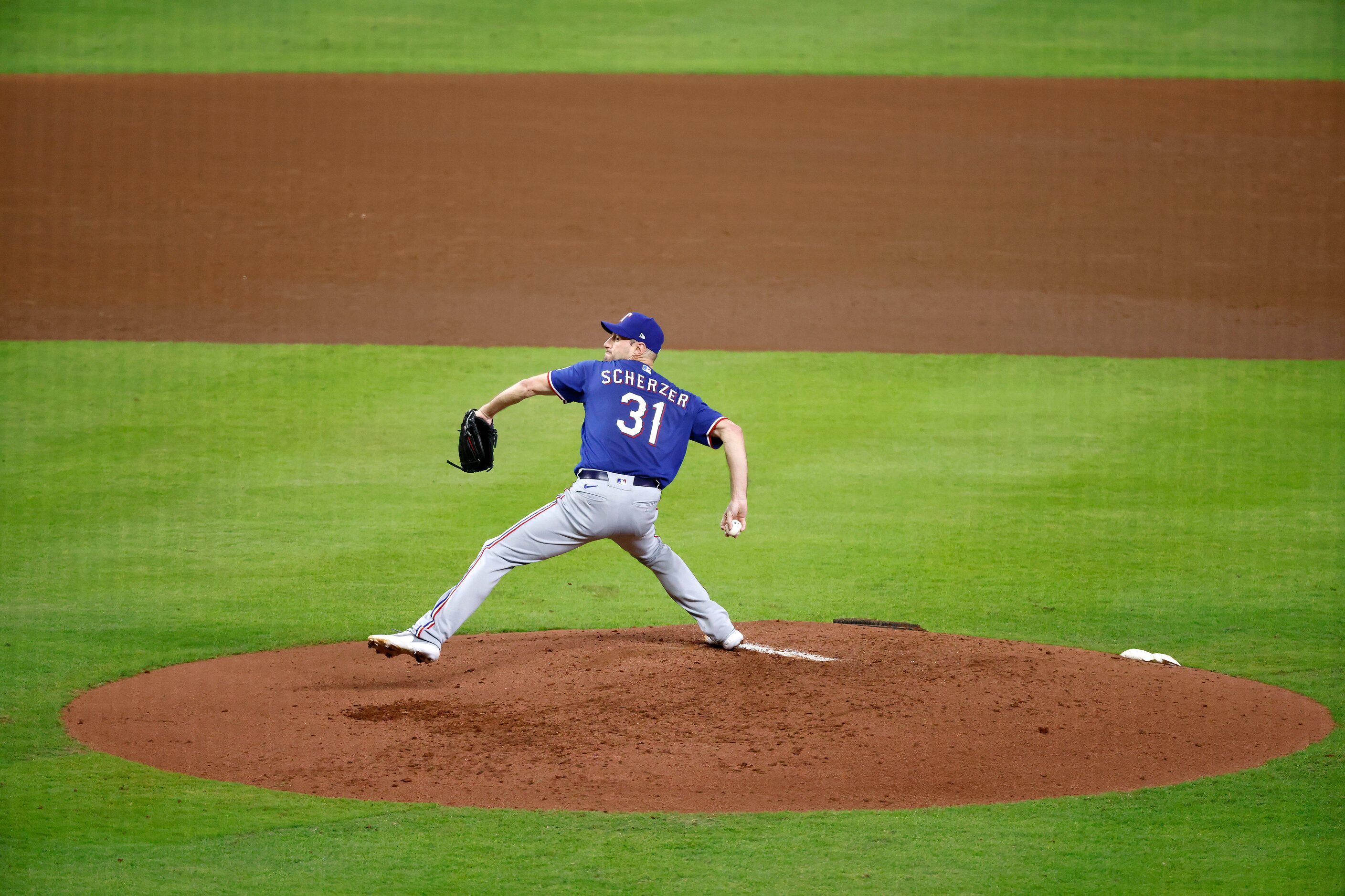 Texas Rangers starting pitcher Max Scherzer throws during second inning in Game 7 of the...