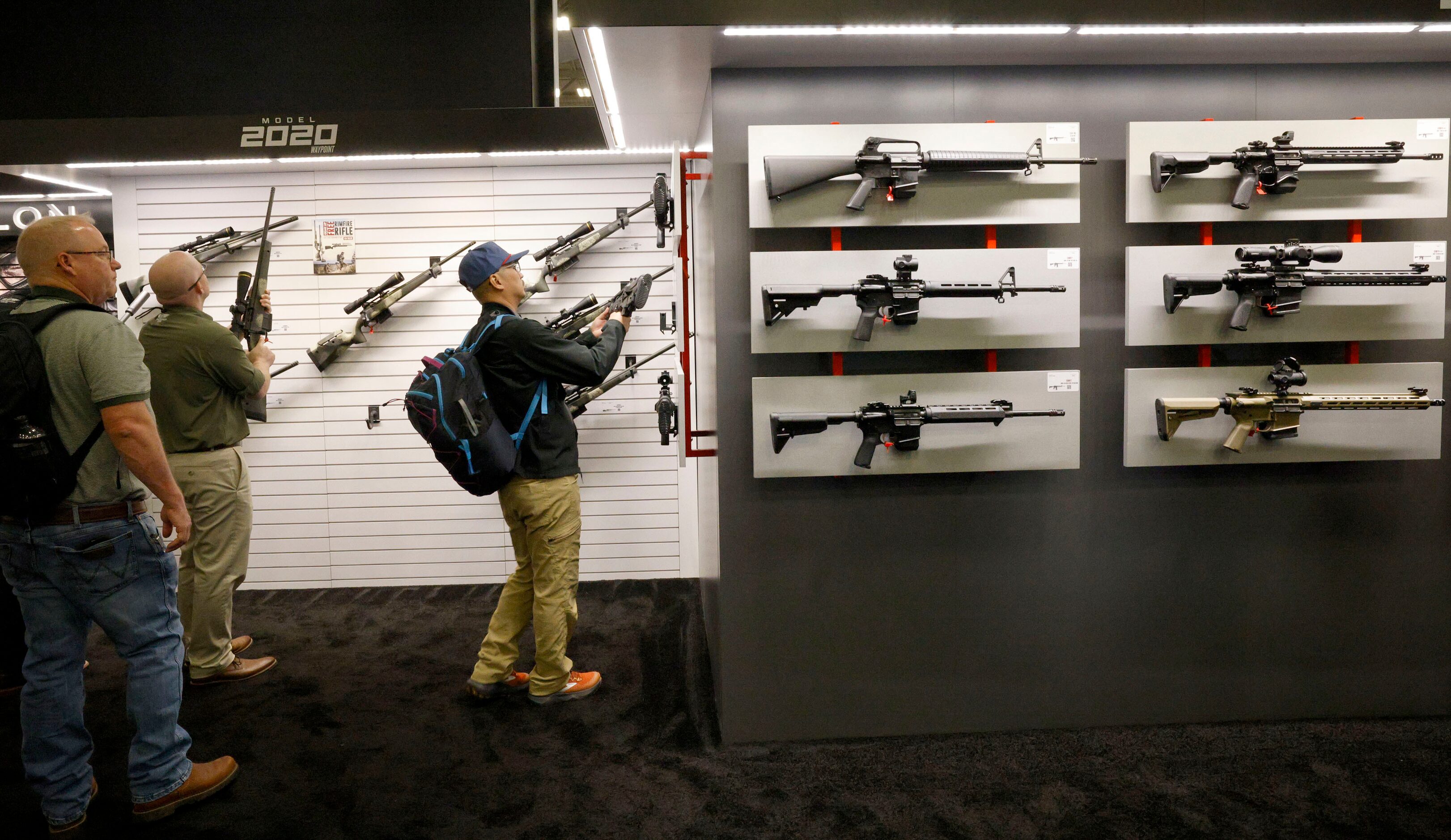 People check the products at the booth of Springfield Armory during 2024 NRA Annual Meetings...