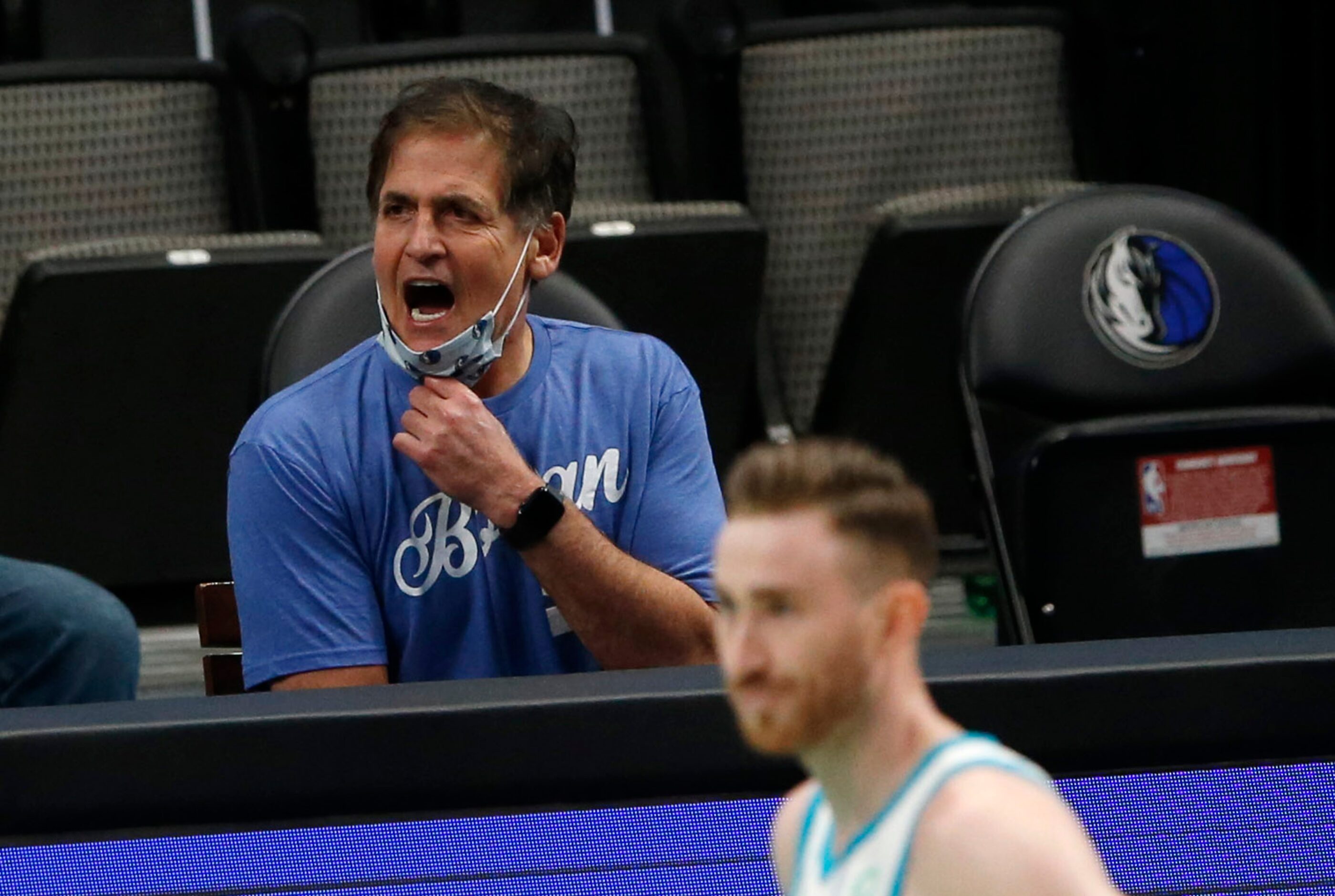 Dallas Mavericks owner Mark Cuban questions a call as they play the Charlotte Hornets during...