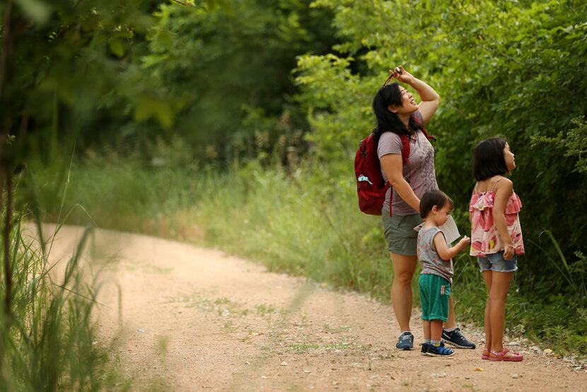 Daphne Pee and her children Ada Stuyvenberg, 7, and Ian Stuyvenberg, 2, take a stop along...