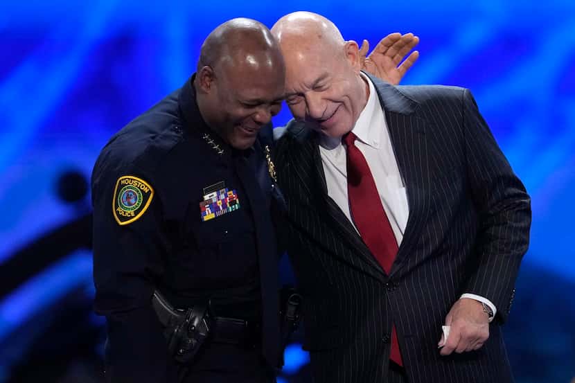 Houston Mayor John Whitmire, right, is embraced by Houston Police Chief Troy Finner during a...