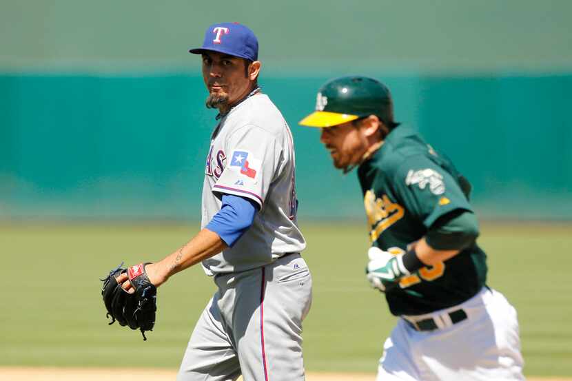 Aug 3, 2013; Oakland, CA, USA; Texas Rangers pitcher Matt Garza (22) reacts after Oakland...
