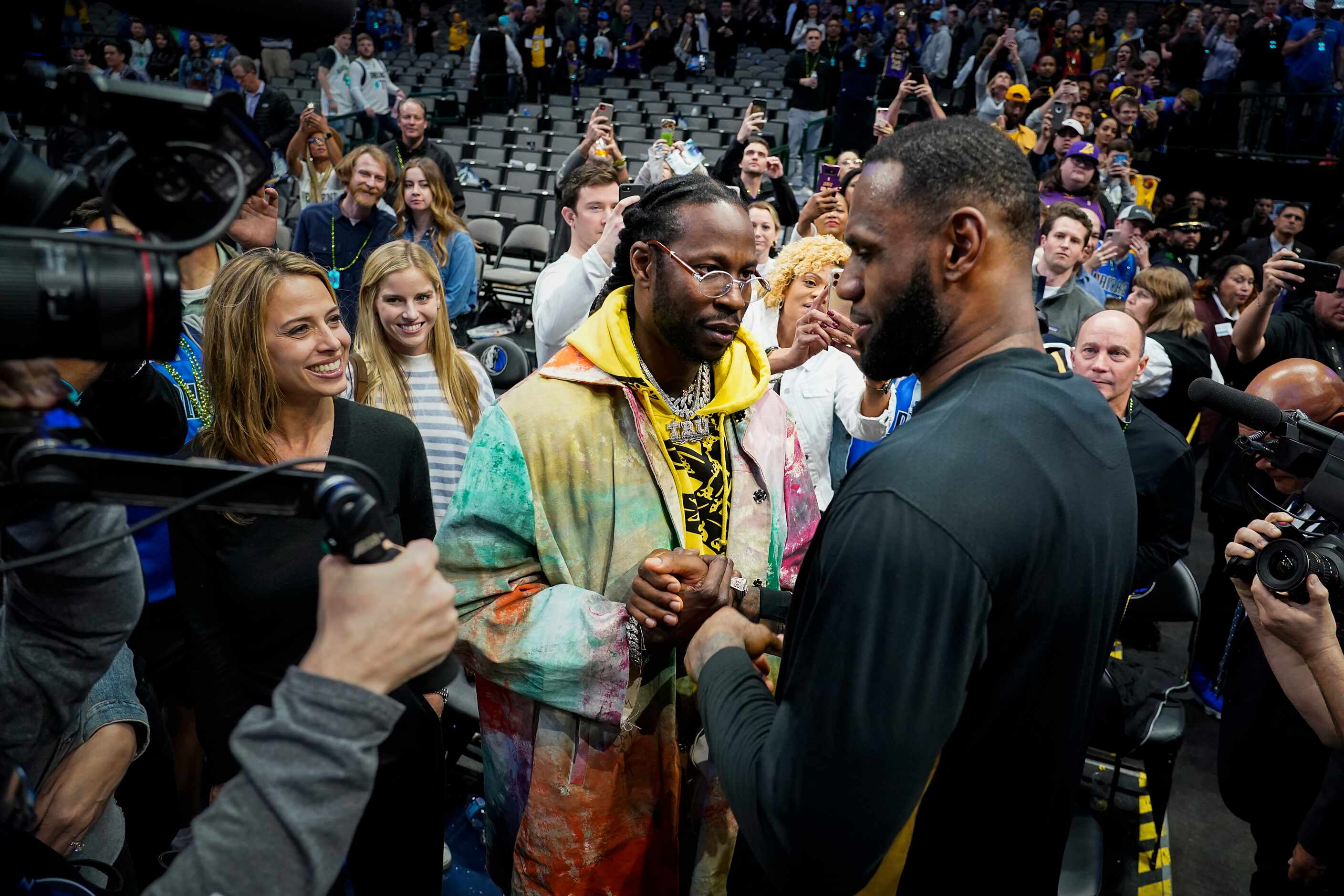 Los Angeles Lakers forward LeBron James (right) talks with rapper 2 Chainz as he leaves the...