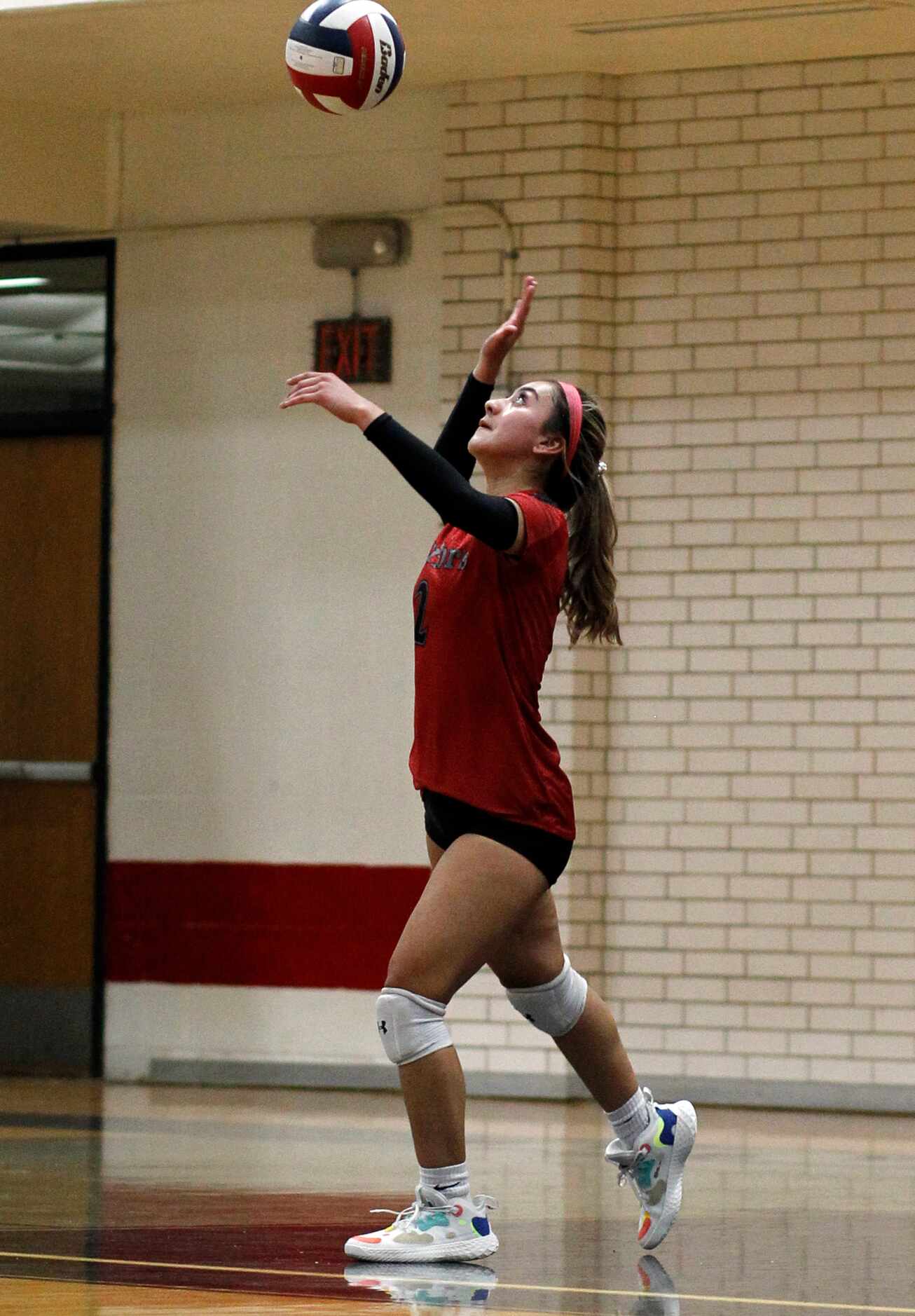South Grand Prairie's Kylie Ramirez (2) serves during the 3rd set of their match against...