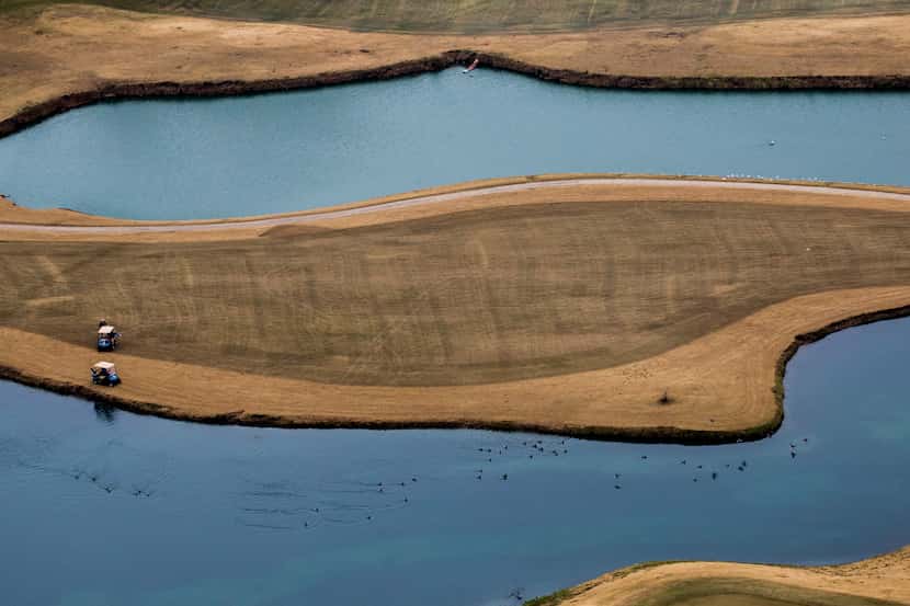 Men play golf at Firewheel Golf Park as photographed from a helicopter on Thursday, December...