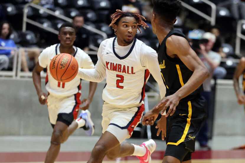 Kimball's Arterio Morris (2) brings the ball downcourt during the Class 5A Region II boys...