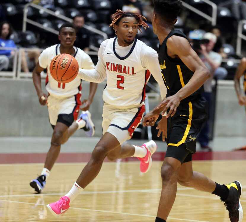 Kimball's Arterio Morris (2) brings the ball downcourt during the Class 5A Region II boys...