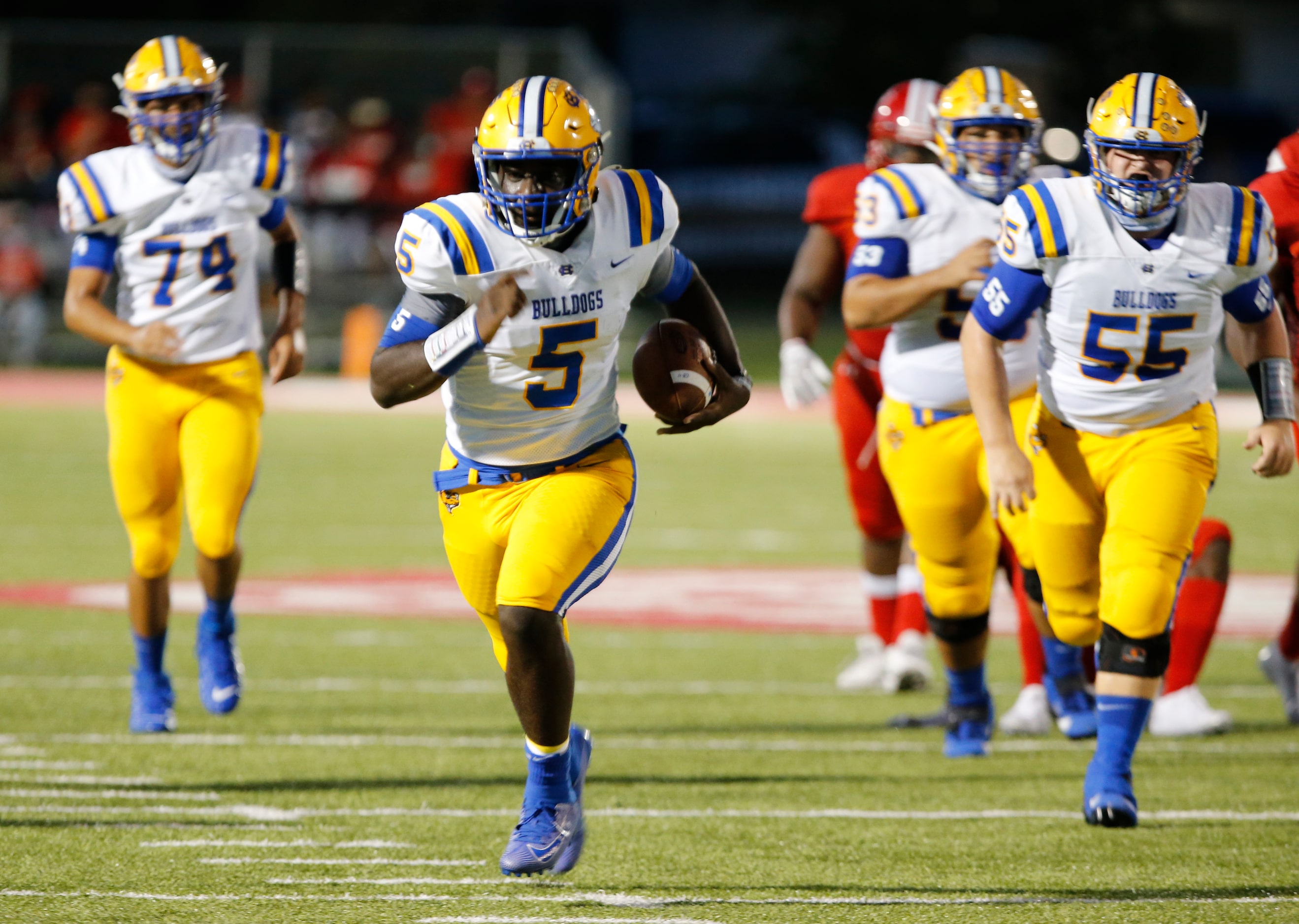 Chapel Hill QB Cameron Ford (5) heads to the end zone for a touchdown during the first half...