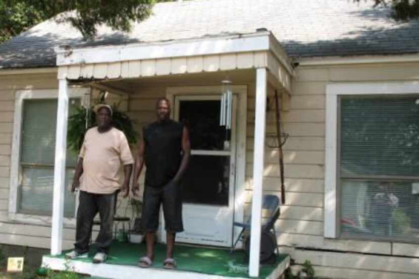 
Charles Johnson, left, and resident Clifton Mims face eviction from the adverse-possession...