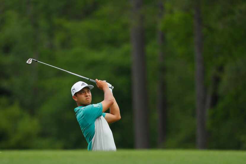 AUGUSTA, GEORGIA - APRIL 12: Xander Schauffele of the United States plays a shot on the 12th...