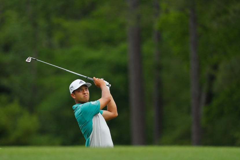 AUGUSTA, GEORGIA - APRIL 12: Xander Schauffele of the United States plays a shot on the 12th...