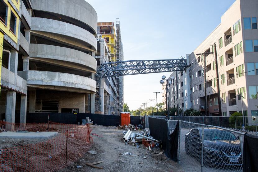 A construction crane remained embedded in the Dallas apartment complex for months before...
