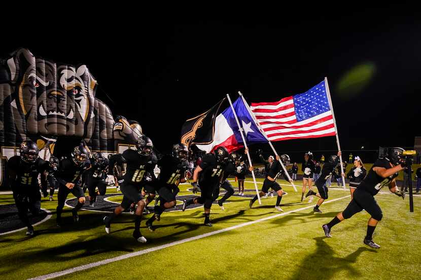 Royse City players take the field before a District 8-5A Division II high school football...