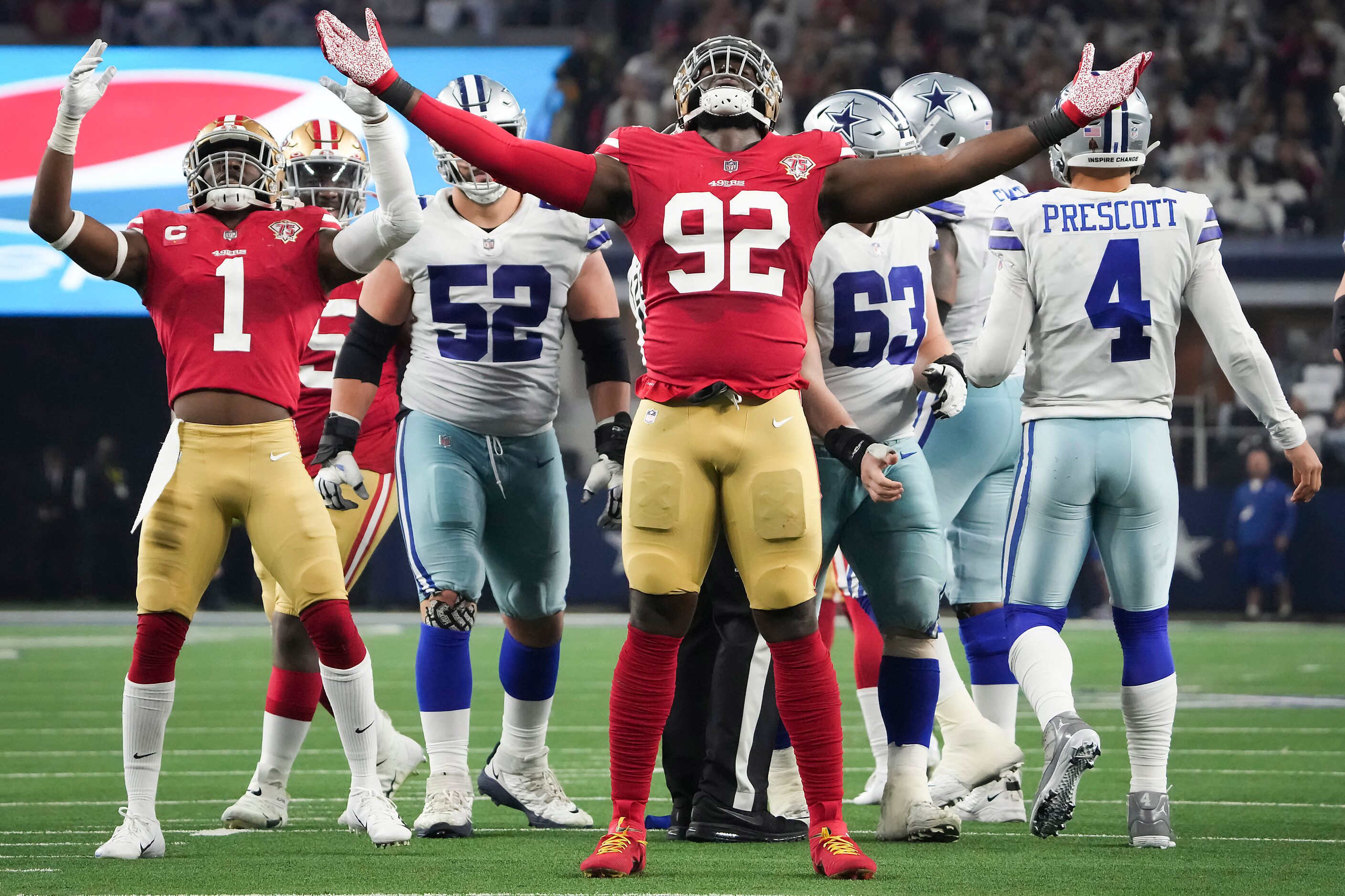 San Francisco 49ers defensive end Charles Omenihu (92) celebrates after sacking Dallas...