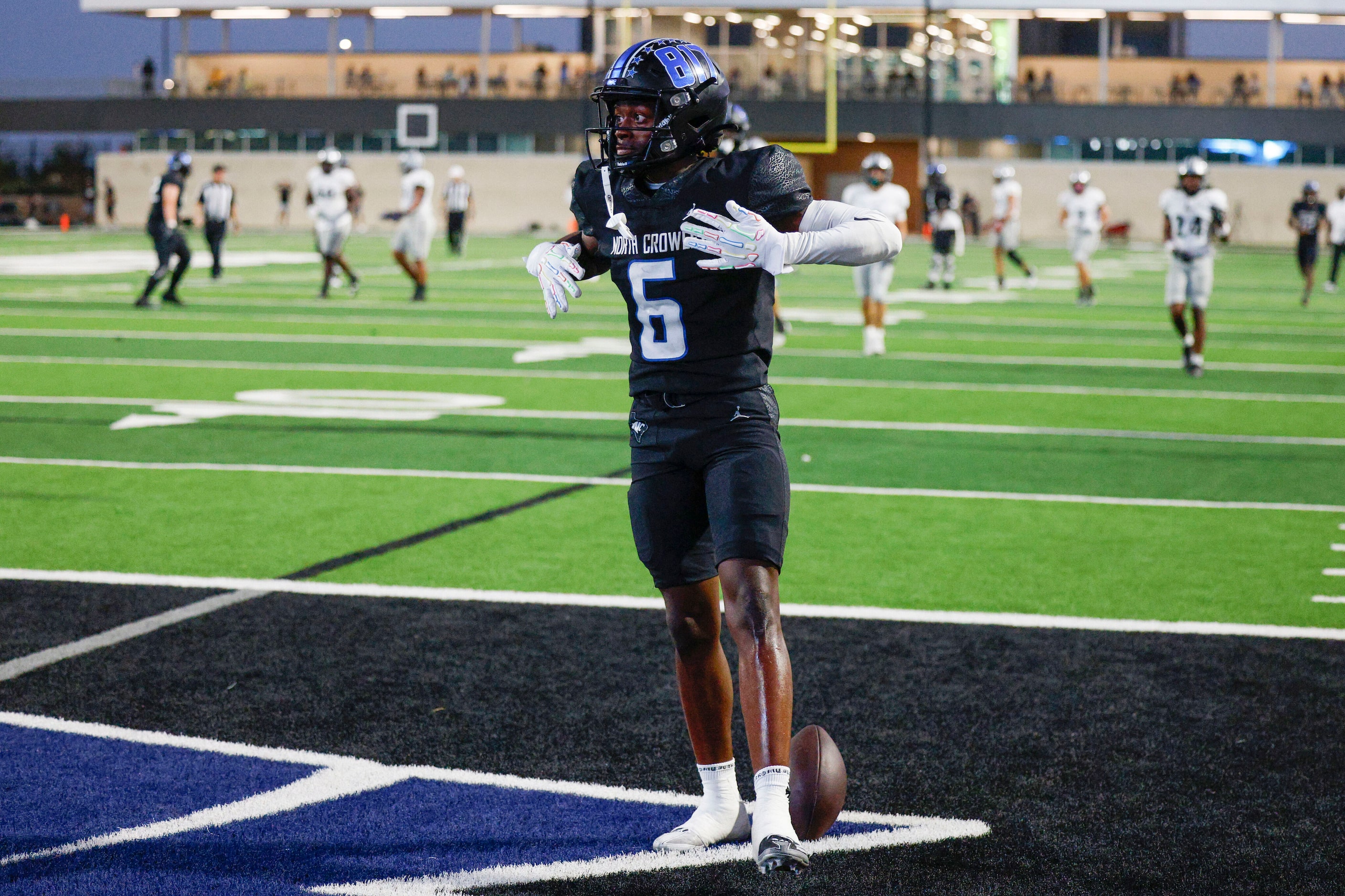 North Crowley wide receiver Quentin Gibson (6) reacts after scoring a 50-yard touchdown...