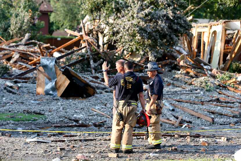 The Plano Fire Department works the scene after a home exploded at about 4:45 p.m. in the...