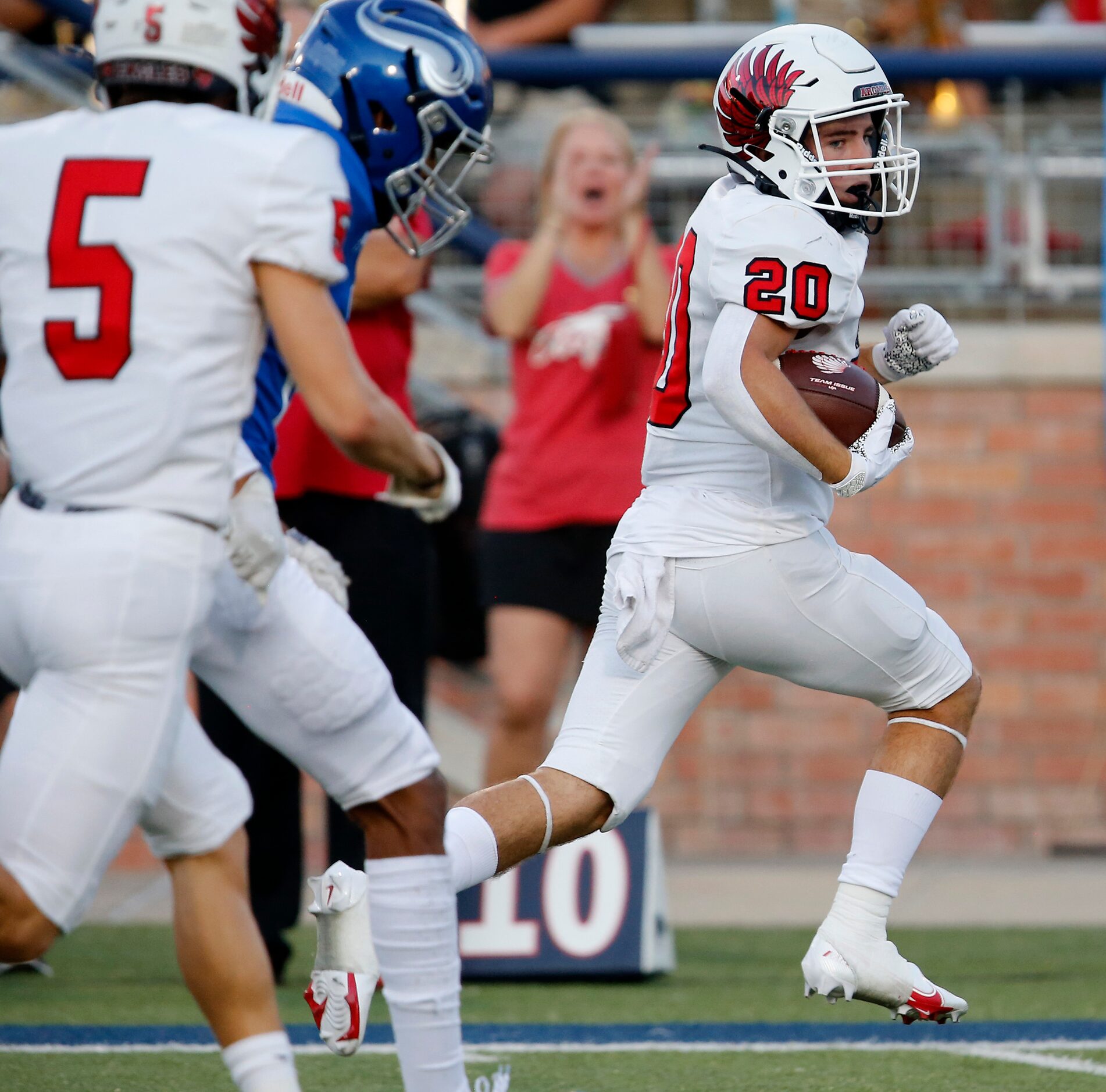 Argyle High School running back Landon Ferris (20) runs for a touchdown during the first...