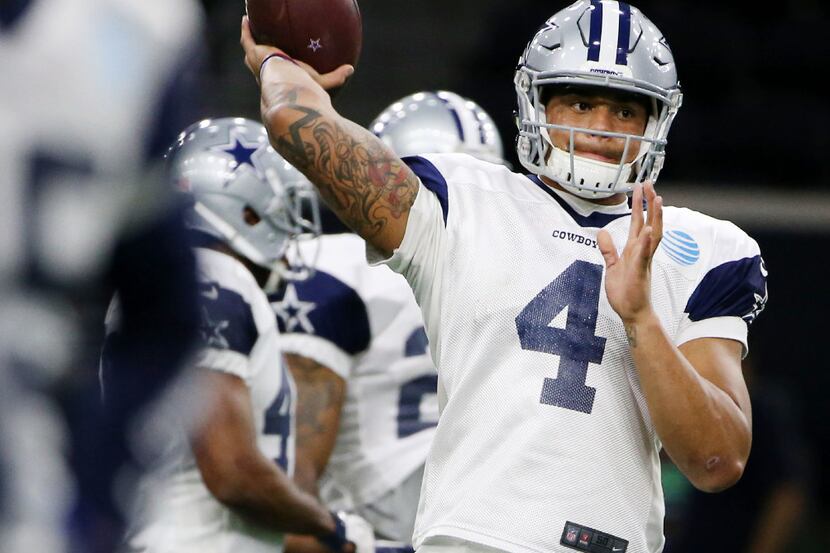 Dallas Cowboys quarterback Dak Prescott (4) throws the ball during team practice at The Star...