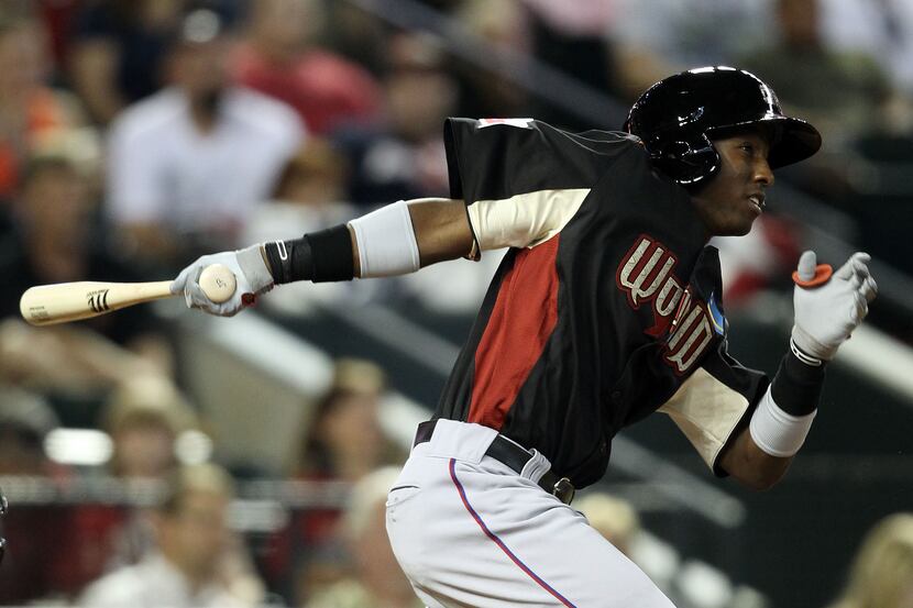 Rangers prospect Jurickson Profar triples in the sixth inning during the 2011 XM All-Star...