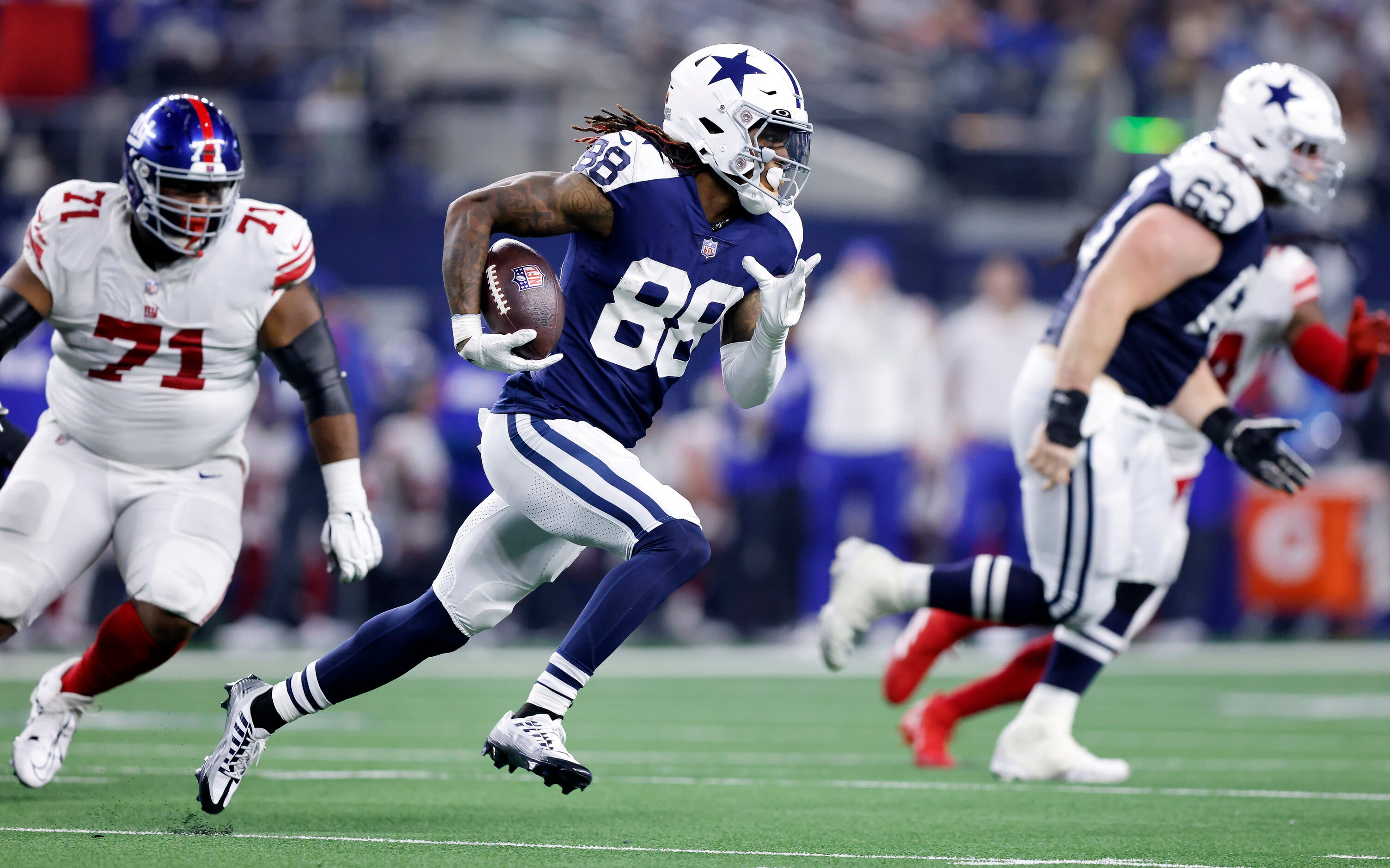 Dallas Cowboys wide receiver CeeDee Lamb (88) races around the end after taking a fourth...