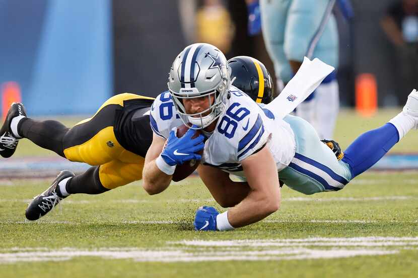 Dallas Cowboys tight end Dalton Schultz (86) dives for extra yards after a first quarter...