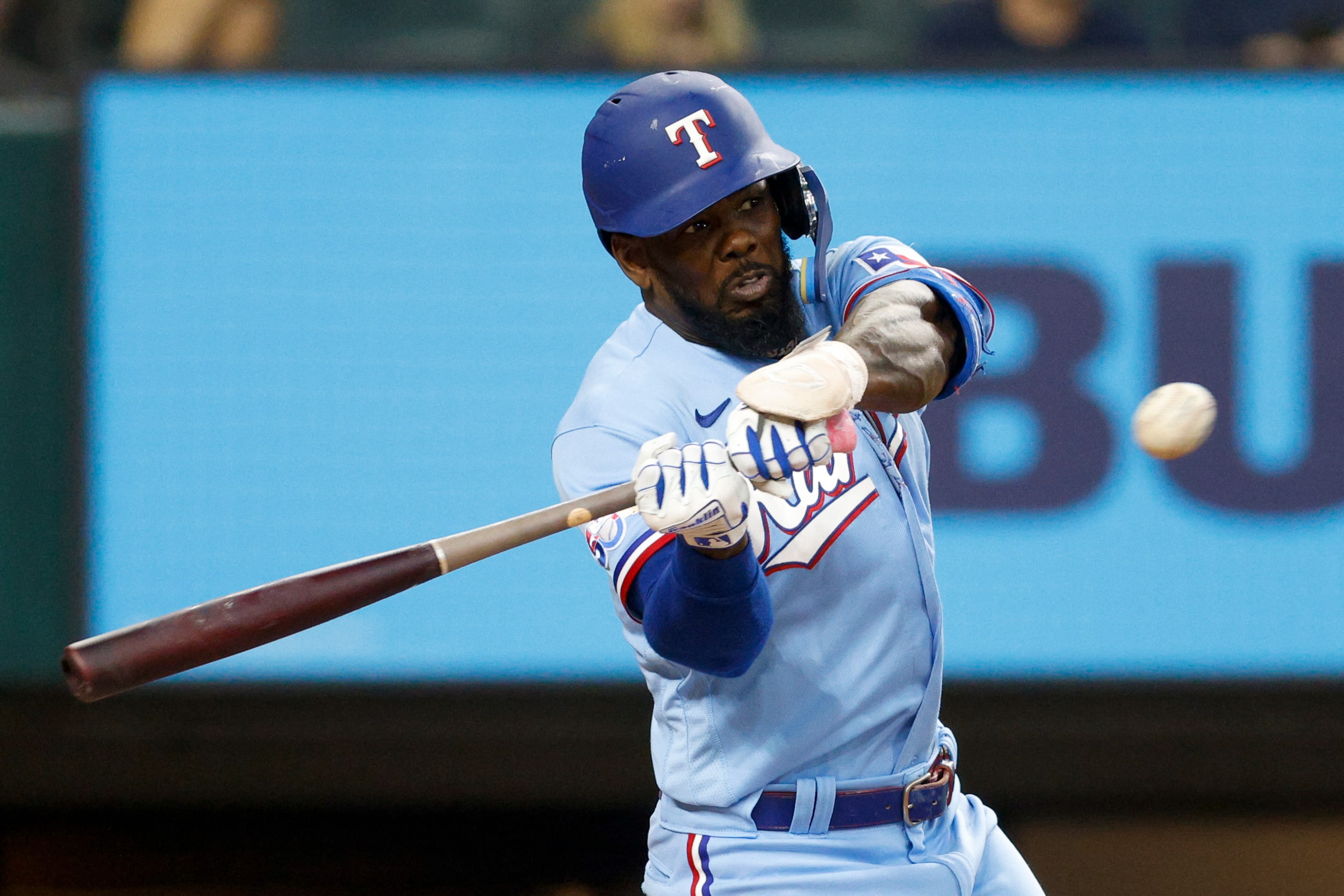 Texas Rangers right fielder Adolis Garcia (53) singles to center field during the fourth...