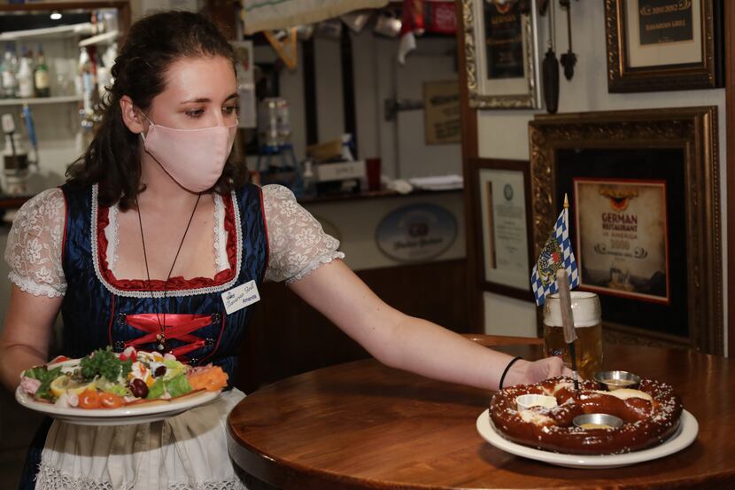 Amanda Huling serves food at Bavarian Grill on Sept. 11, 2020. The Plano restaurant's...