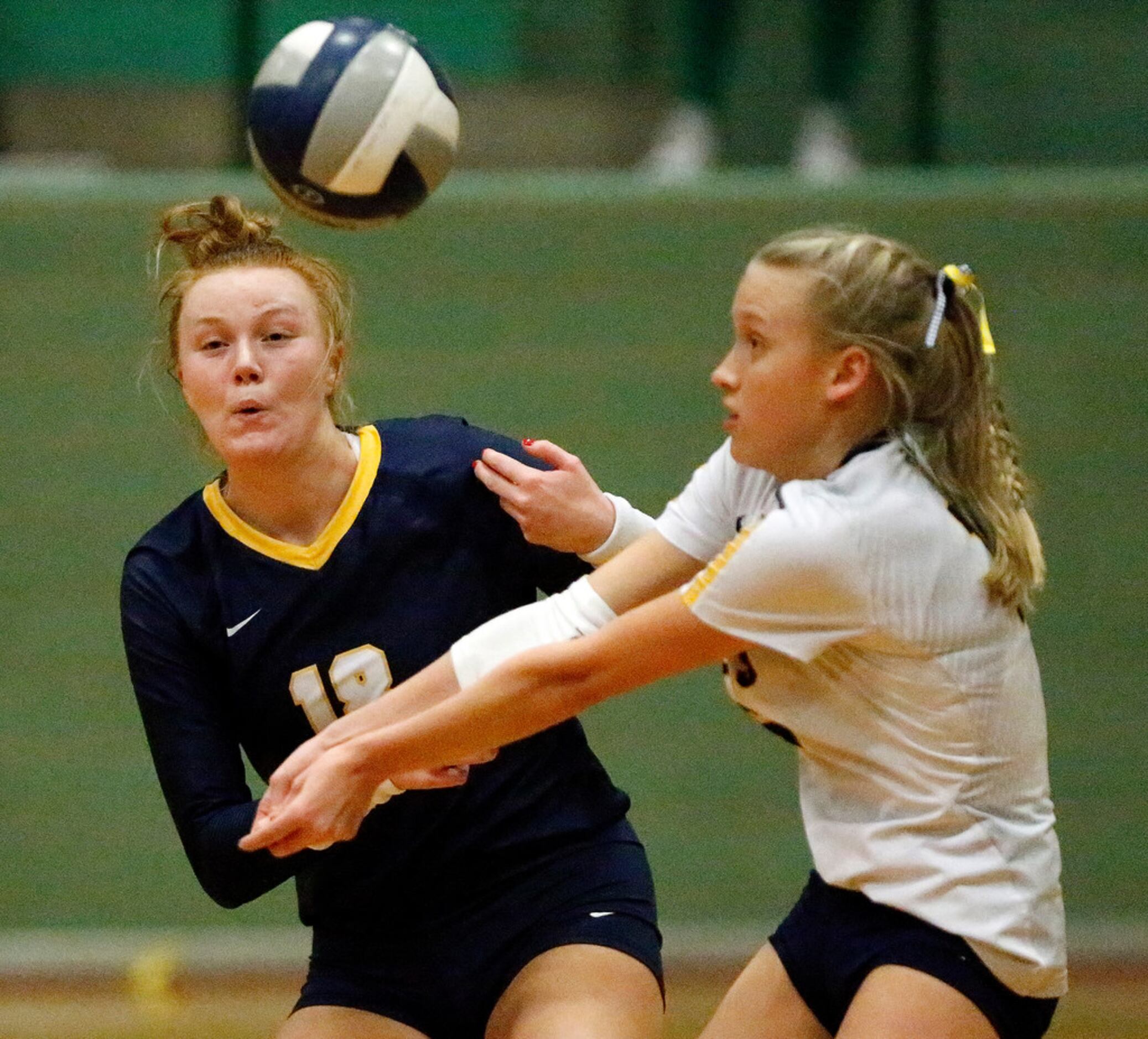 Highland Park High School outside hitter Kendyl Reaugh (18) tries to avoid colliding with...