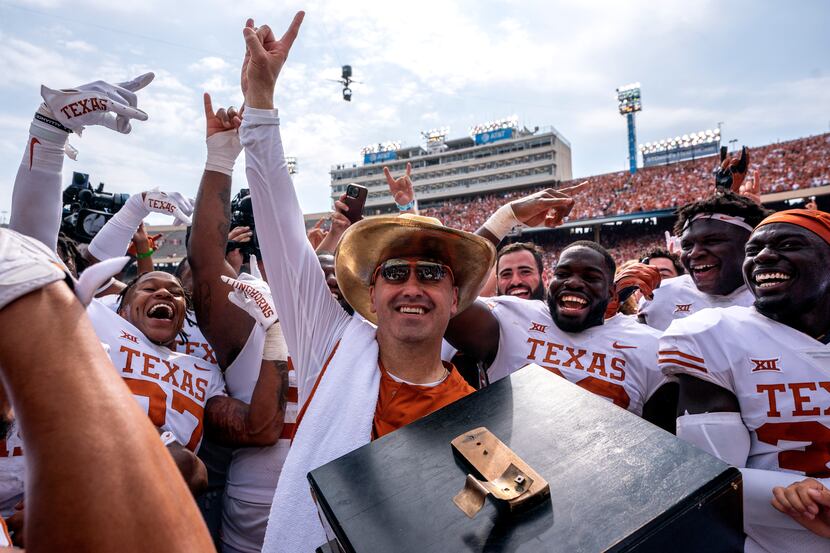 Texas head coach Steve Sarkisian celebrates with the golden hat after his team's 49-0...
