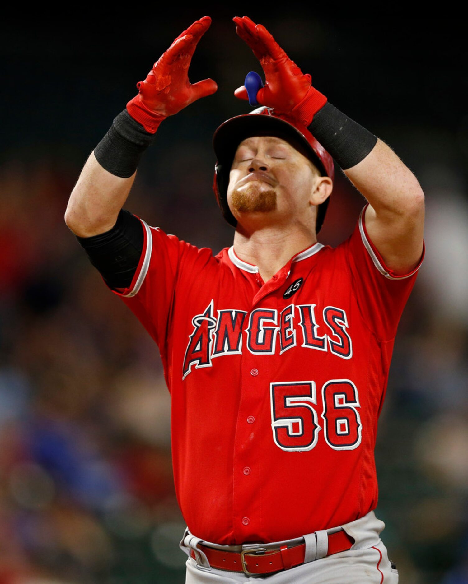 Los Angeles Angels right fielder Kole Calhoun (56) looks up to the sky after hitting a two...