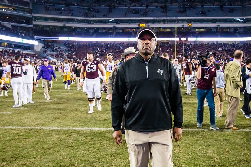 Texas A&M head coach Kevin Sumlin walks off the field after a loss to LSU in an NCAA...