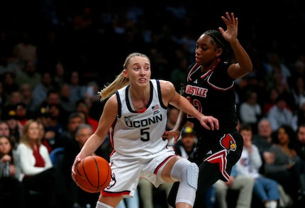 UConn guard Paige Bueckers (left) could be the top overall pick in the 2025 WNBA draft in...