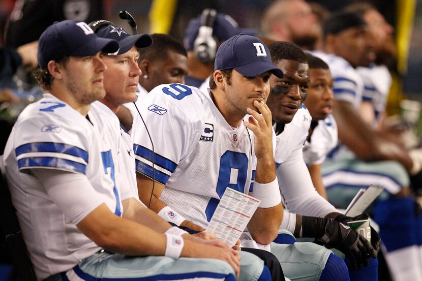Dallas Cowboys quarterback Tony Romo (9) and Dallas Cowboys quarterback Stephen McGee (7)...