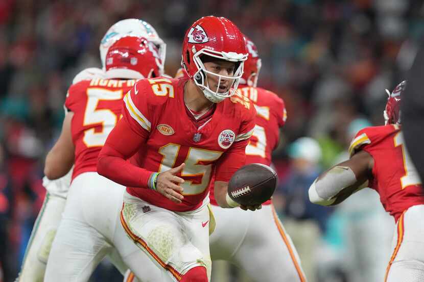 Kansas City Chiefs quarterback Patrick Mahomes hands off during the second half of an NFL...