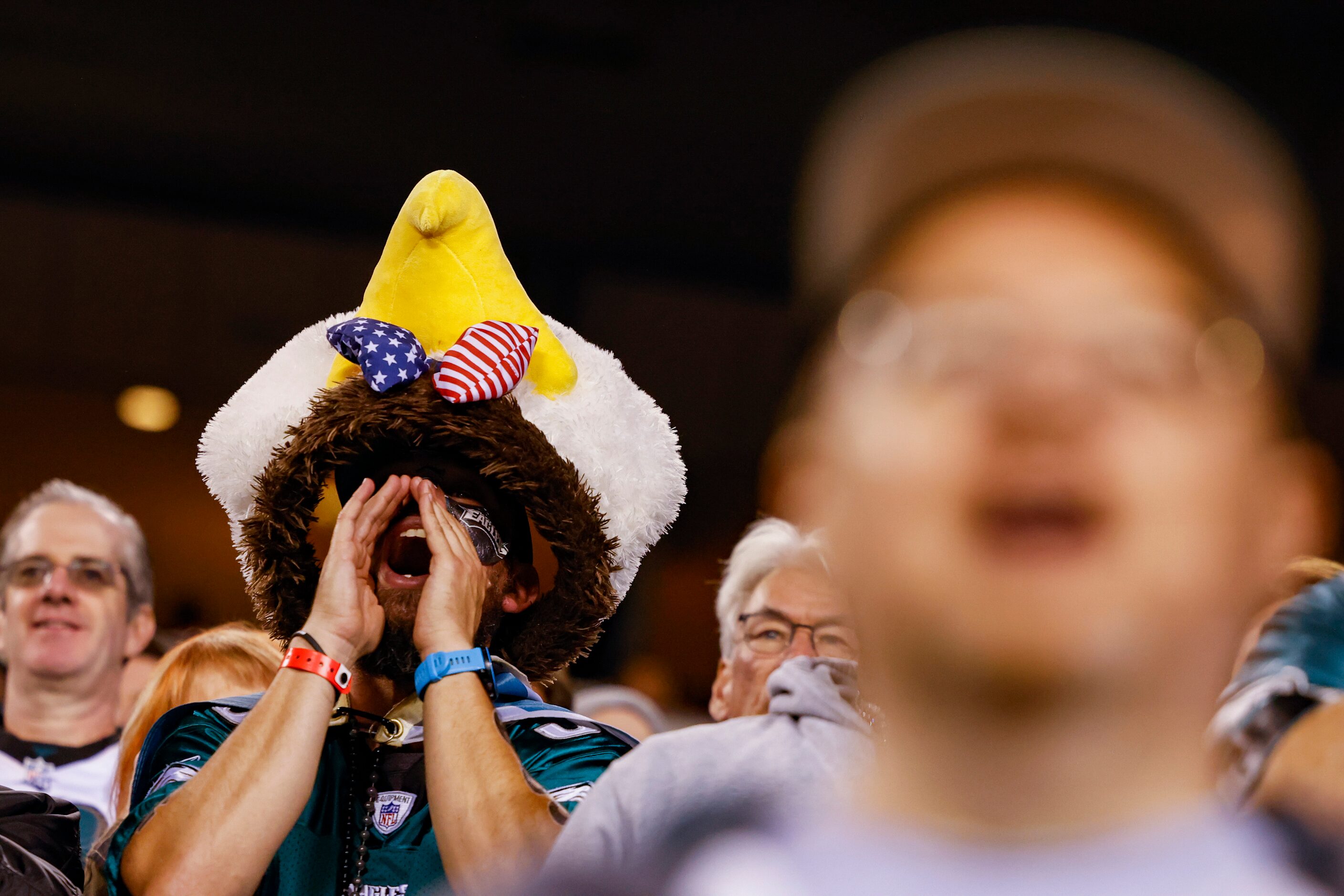 A Philadelphia Eagles fan wearing an eagle head yells during the first half of a Dallas...