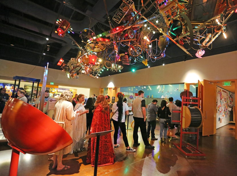 Attendees wait to enter an exhibit on a Science on Tap evening at the Fort Worth Museum of...