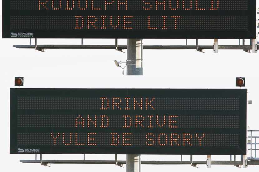 Signs on Highway 67 show holiday-themed safety messages in December 2019. The quips could be...