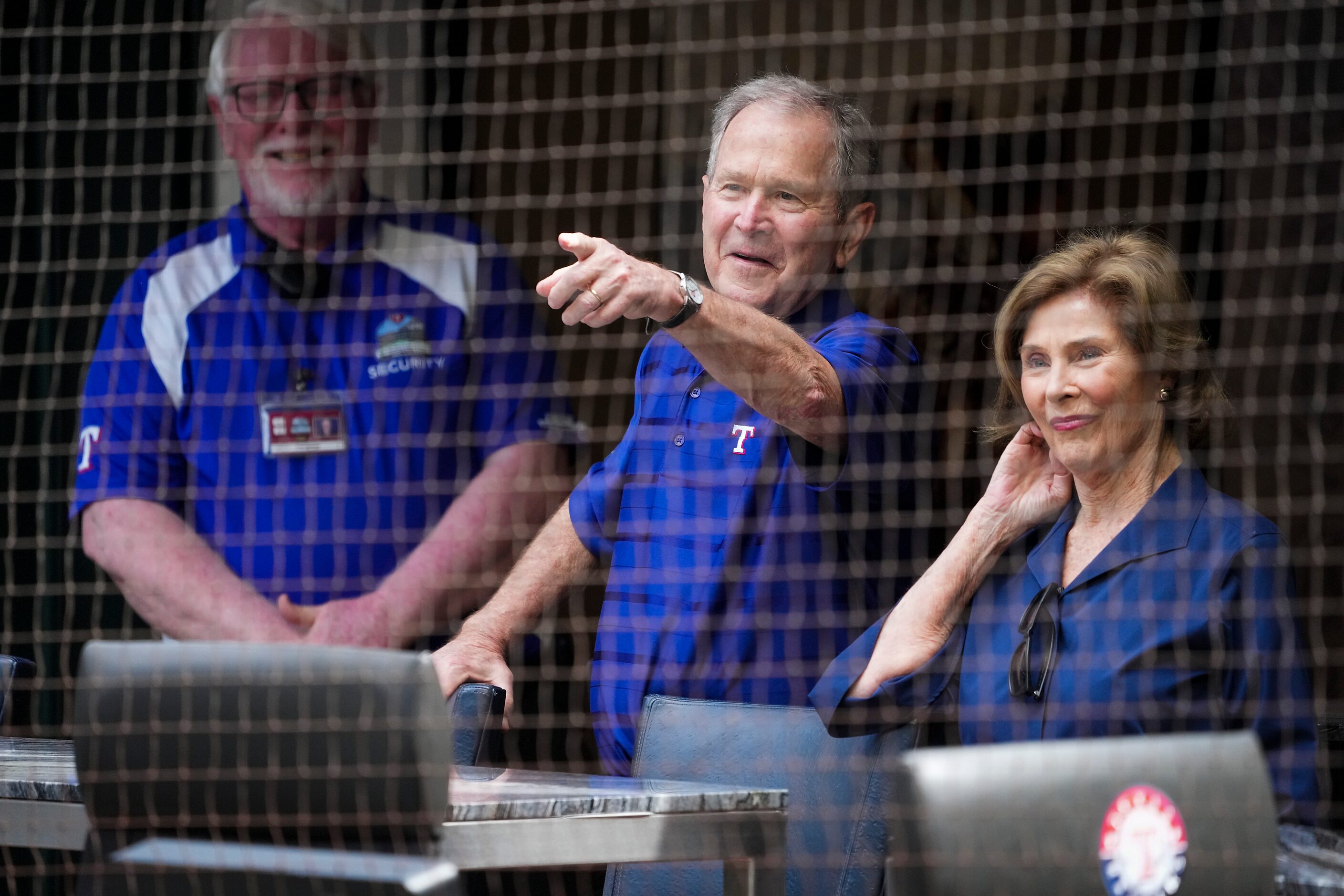 Former President George W. Bush and Laura Bush watch pregame activities before the Texas...