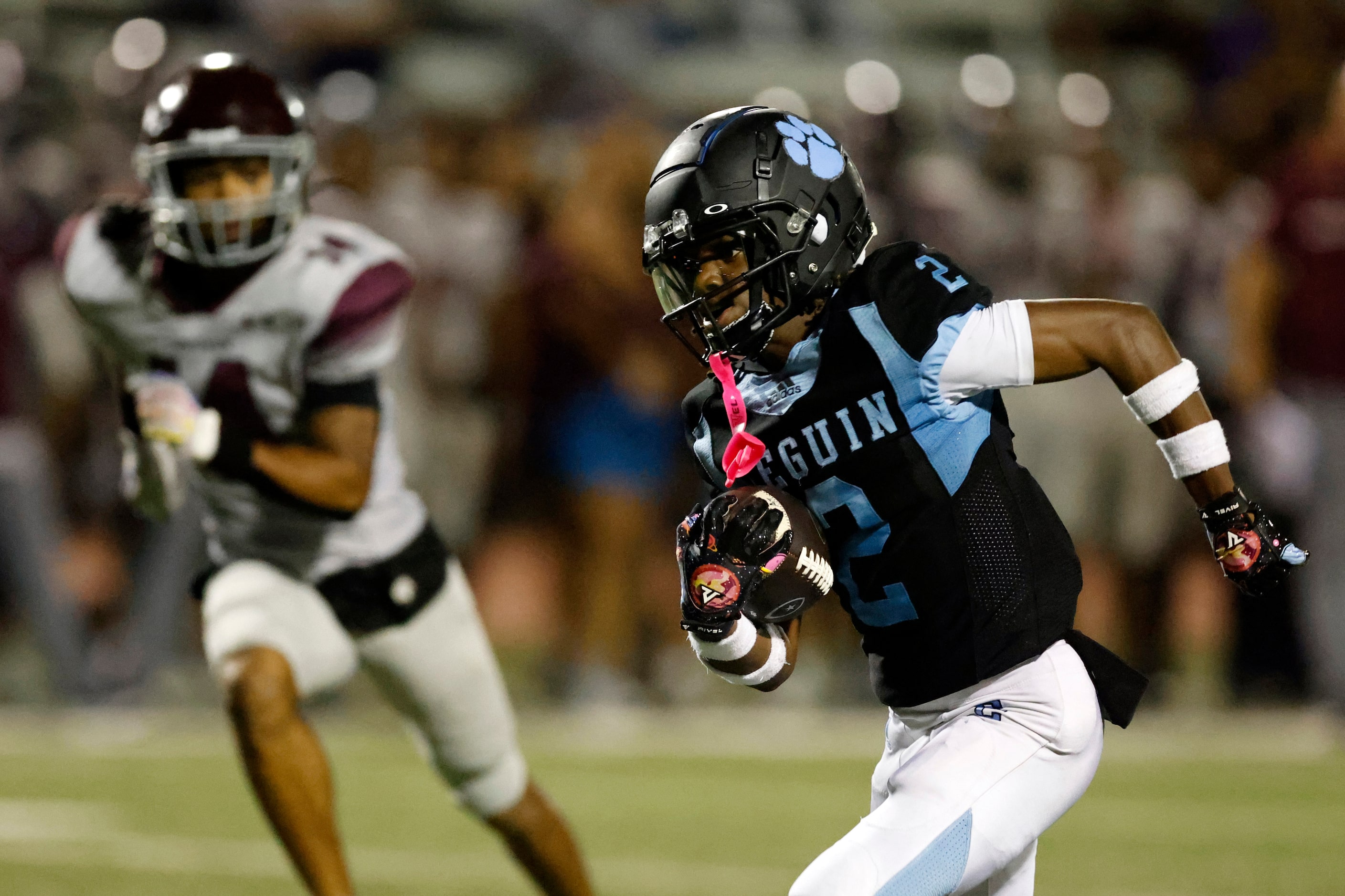 Arlington Seguin wide receiver G'mani Smith (2) runs for a touchdown after a catch during...