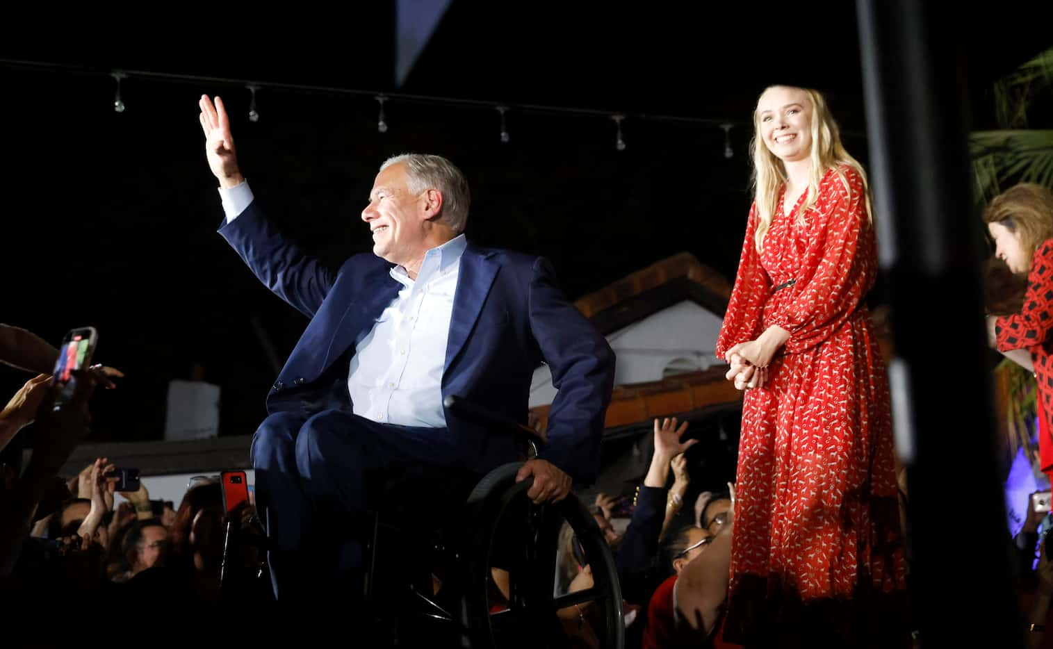 Joined by his daughter, Audrey Abbott, and wife, Cecilia Abbott, Texas Governor Greg Abbott...