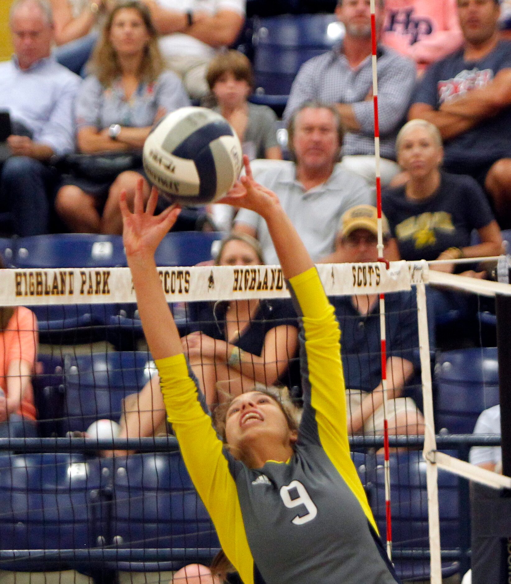 Highland Park setter Gracie Braner (9) lunges to set the ball for a teammate during the 2nd...