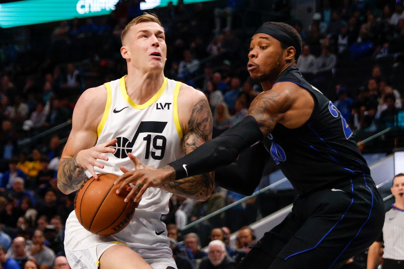 Dallas Mavericks forward Richaun Holmes (20) steals the ball from Utah Jazz forward Luka...