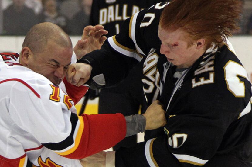Dallas Stars Cody Eakin is bloodied but fights the good fight against Calgary's Jarome...