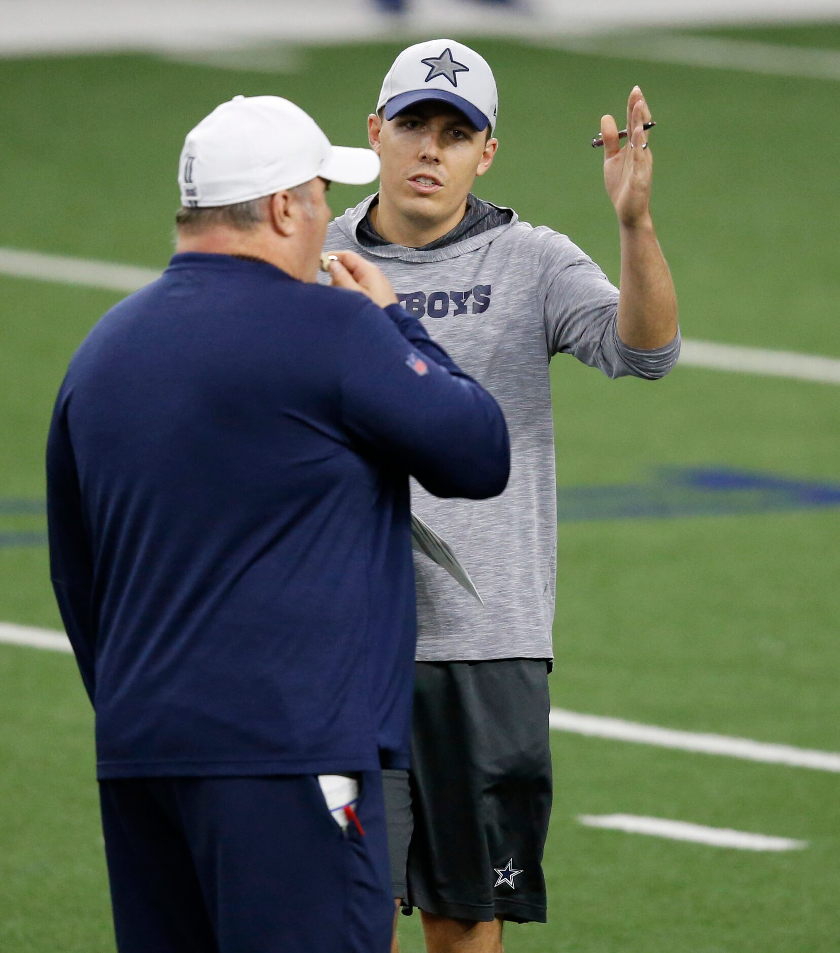 Dallas Cowboys head coach Mike McCarthy talks with Dallas Cowboys offensive coordinator...