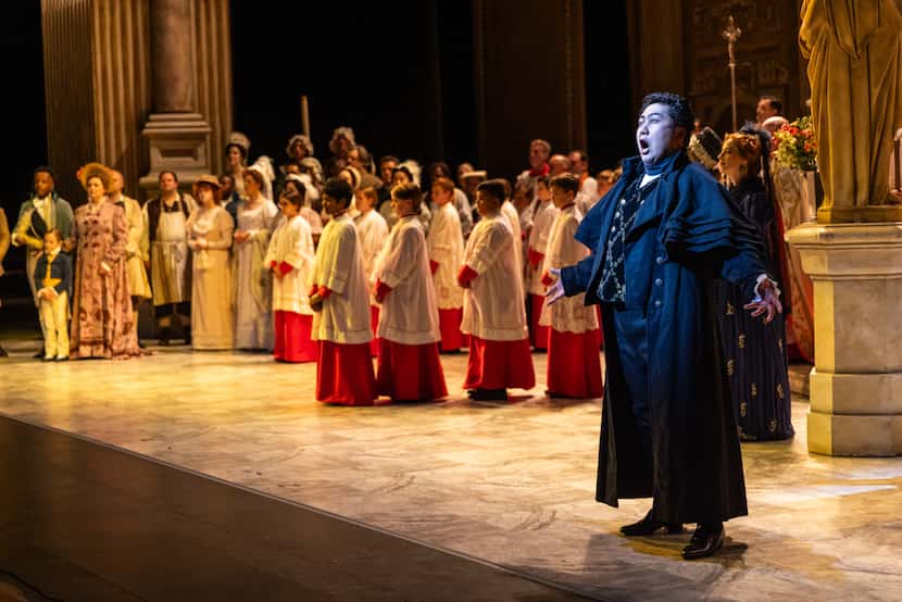Gihoon Kim (Scarpia) performed during a dress rehearsal for the Dallas Opera production of...