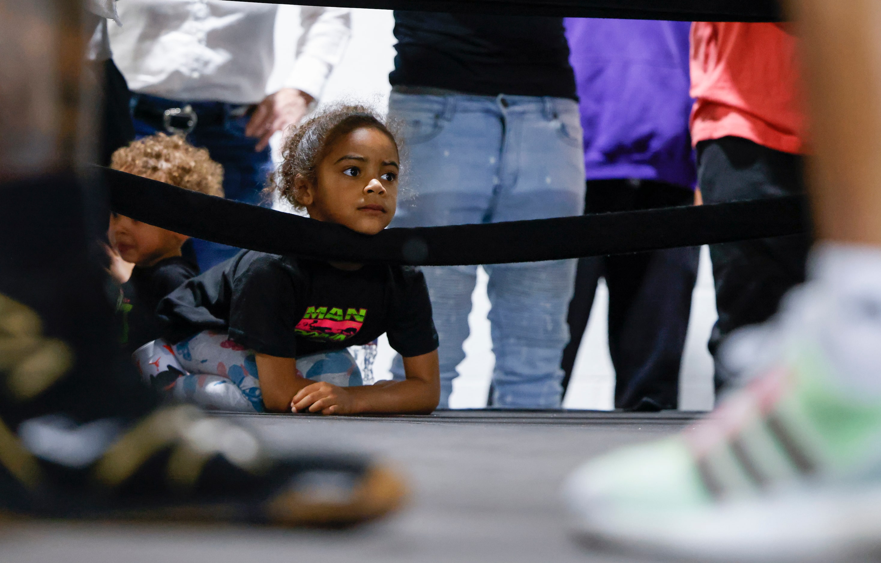 Ivy Spence, daughter of Errol Spence Jr. of Desoto watches his father practice during a...