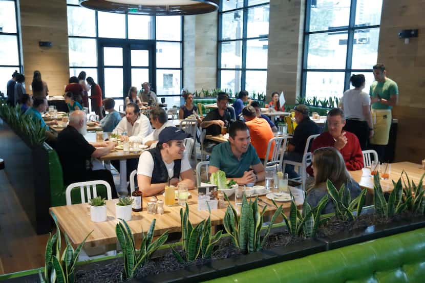 The lunch crowd starts to fill True Food Kitchen at Legacy West in Plano on Friday May 19,...
