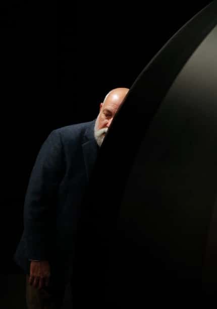 Jimmie Henslee listens to the sounds emitted by a piece by Yuri Suzuki called "Sound of the...
