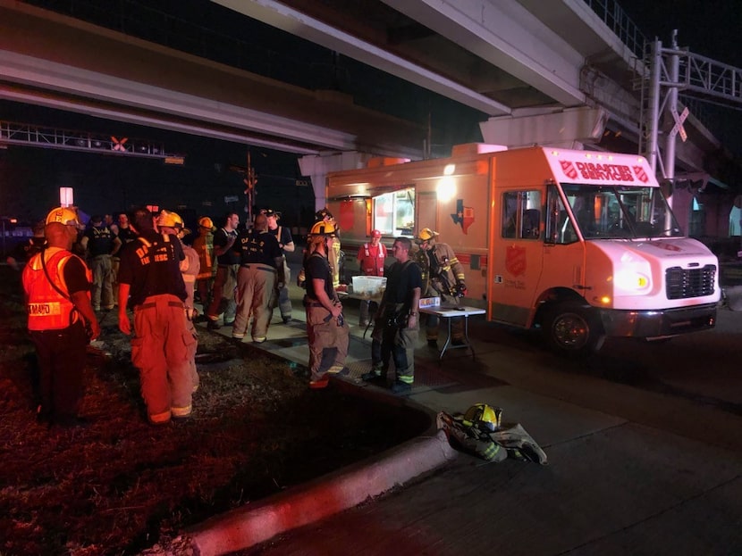 Salvation Army crews provide water, gatorade and snacks to first responders and resident...